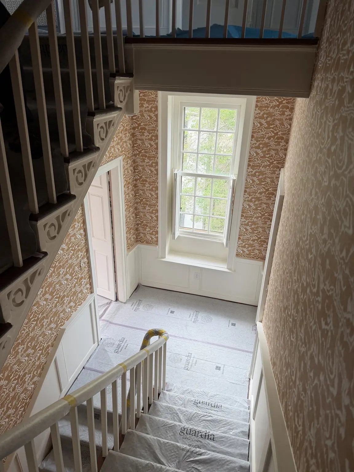 Three-story wallpaper installation in the historic 45 Tradd Street residence in Charleston South Carolina